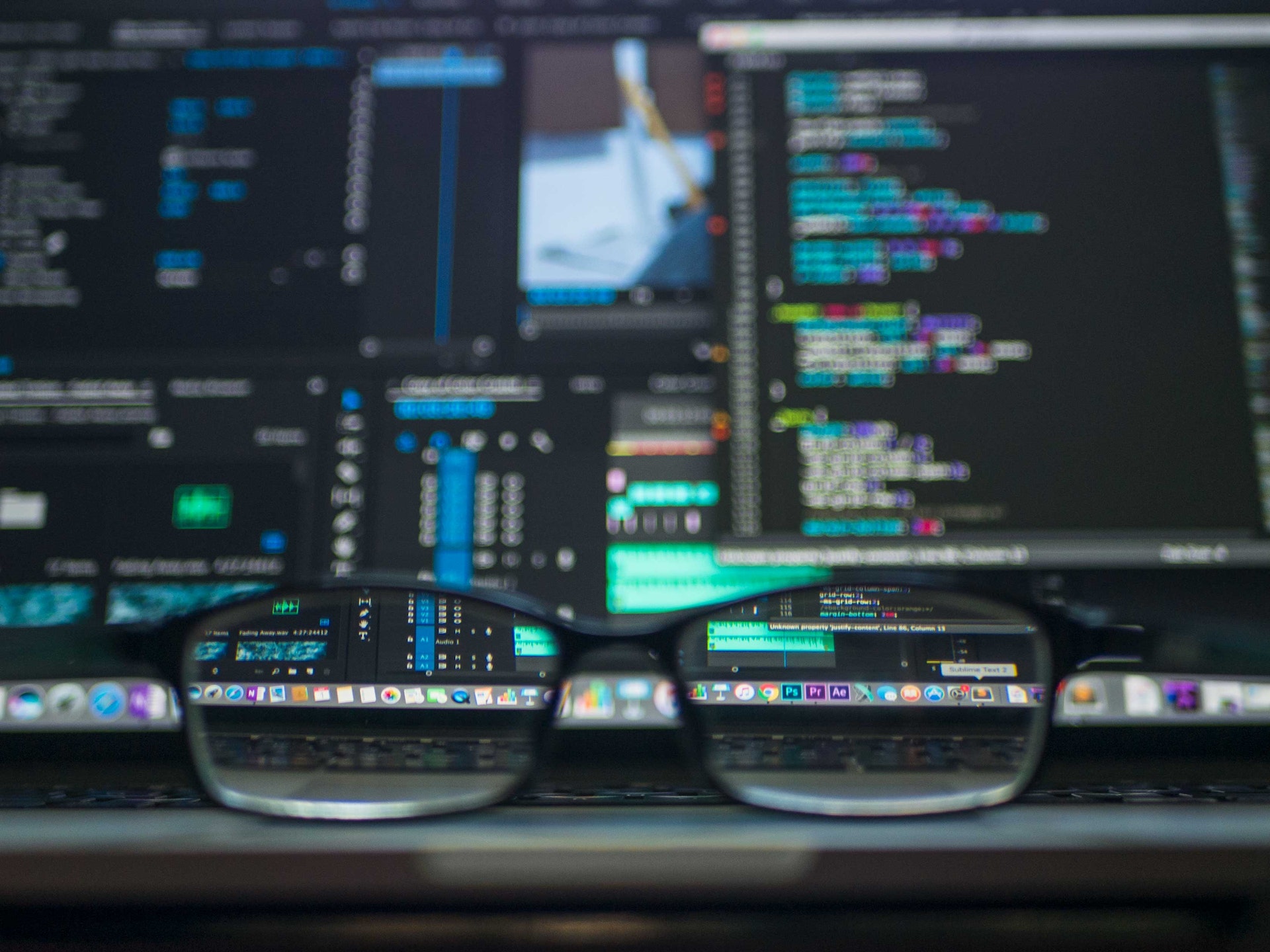 CodeWithGlassesOnDesk